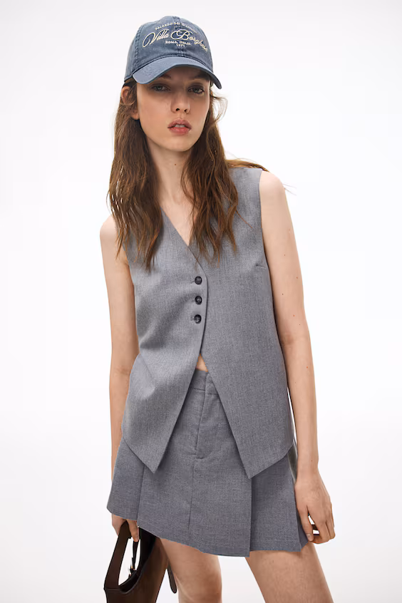 Длинный жилет