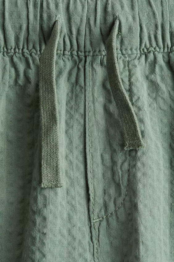 Брюки из тонкого хлопка с различными складками