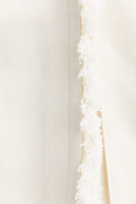 Юбка с кружевной отделкой и бахромой