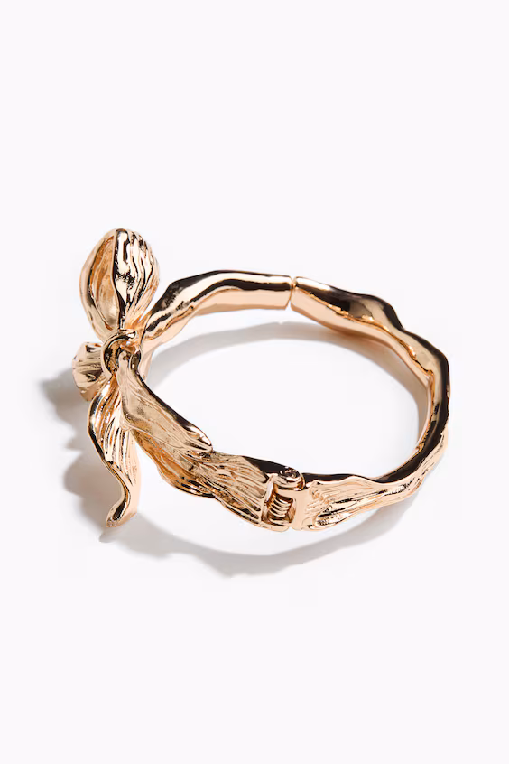 Жесткий артикулированный браслет с бантом