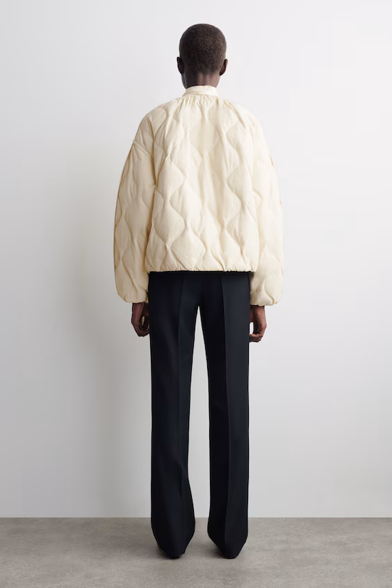 Пуховой жилет с складками