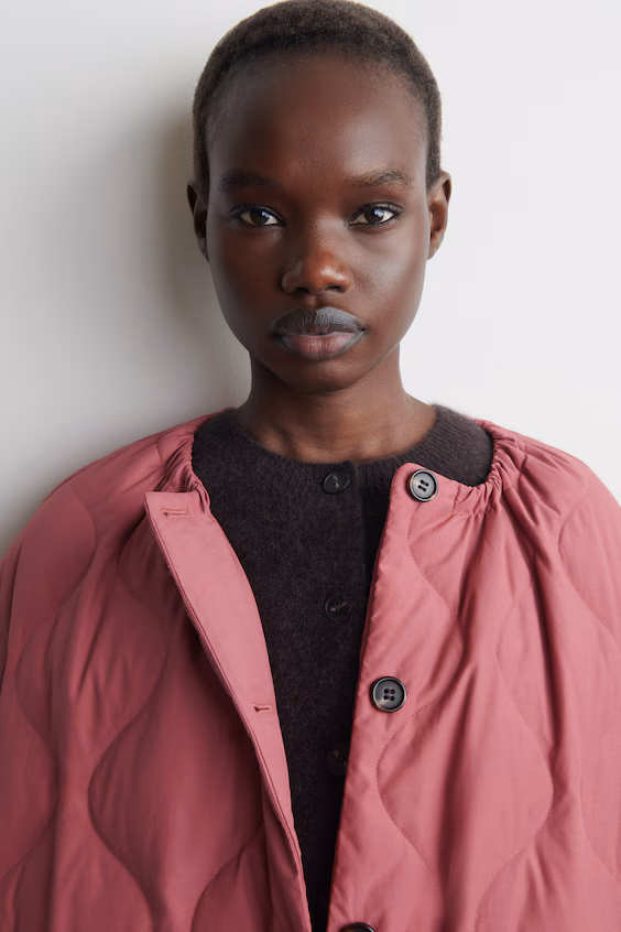 Пуховой жилет с складками