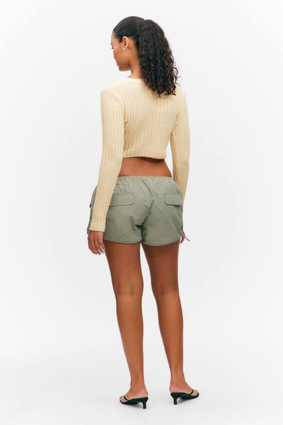 Пуловер из рубчатого трикотажа с асимметричным перекрещивающимся вырезом