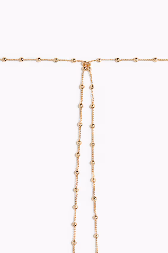 Длинное золотистое цепочка