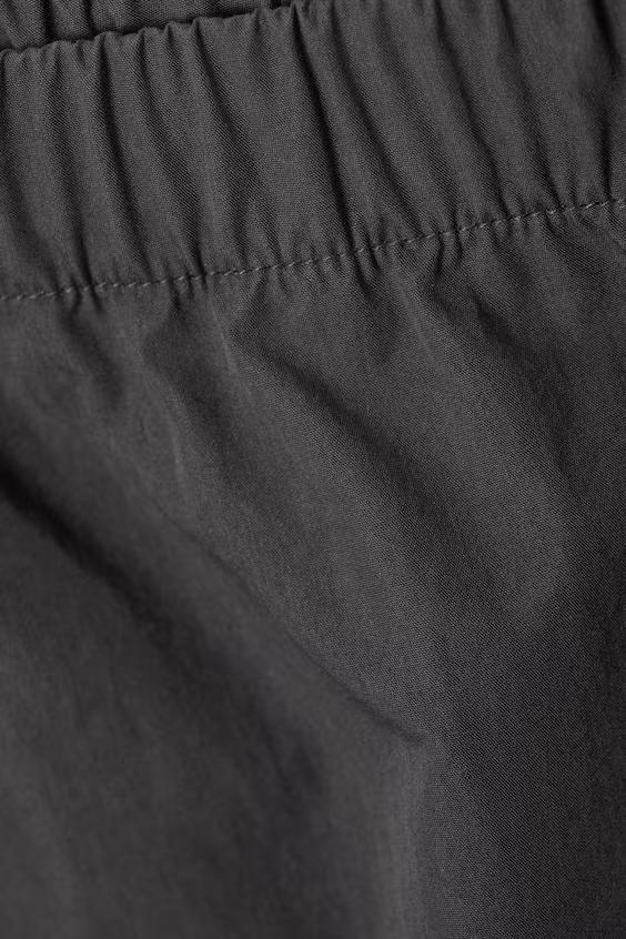 Брюки комбинезон с опущенной талией и широкими брючинами