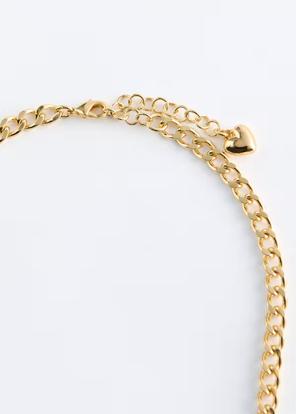 Украшенное цепью колье