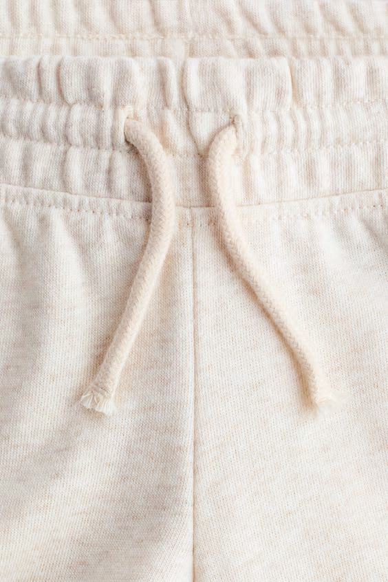 Брюки-клеш из меланжевого вязаного полотна