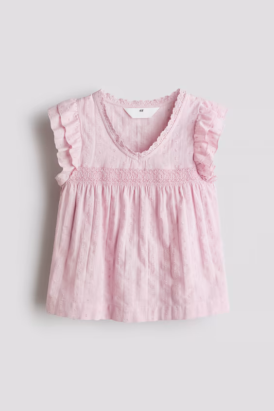 Блузка с рюшами на рукавах