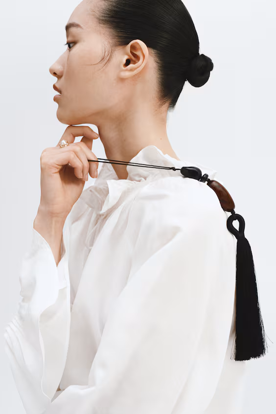 Украшение для чемодана с кисточкой