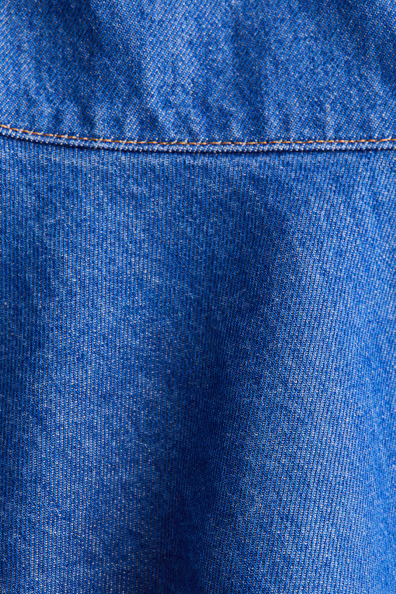 Джинсовая мини-юбка со встречным оборком