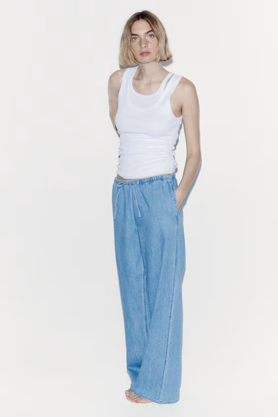 Джинсы в голубом дениме с завязкой