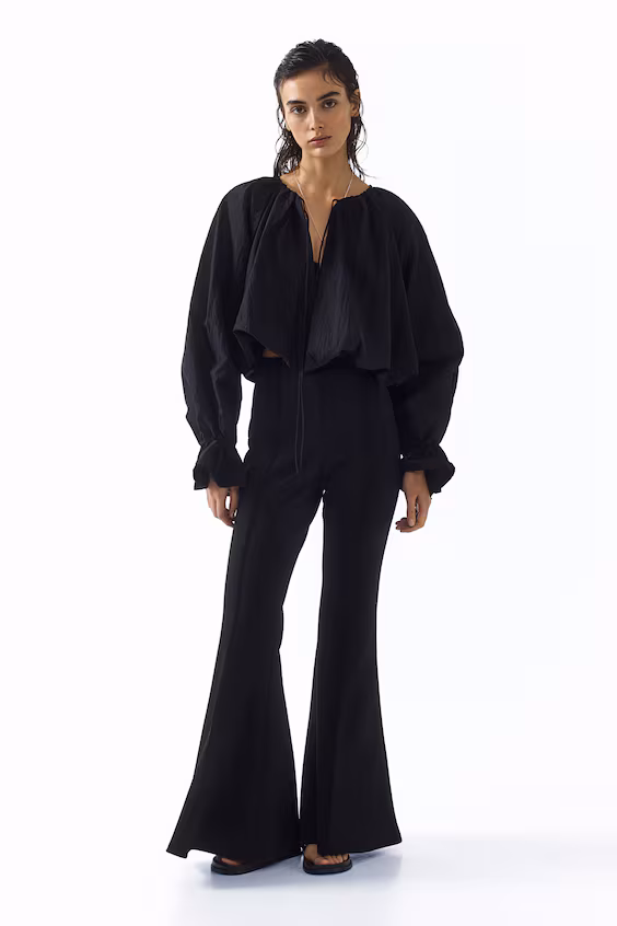 Брюки с вытянутыми штрихами в стиле колокола