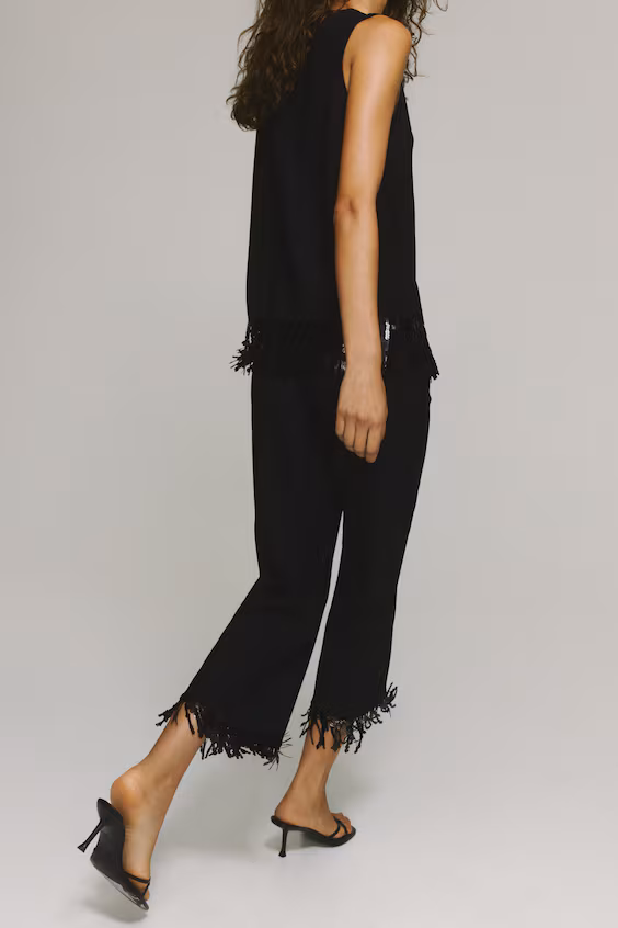 Брюки с рюшами и пайеточной бахромой