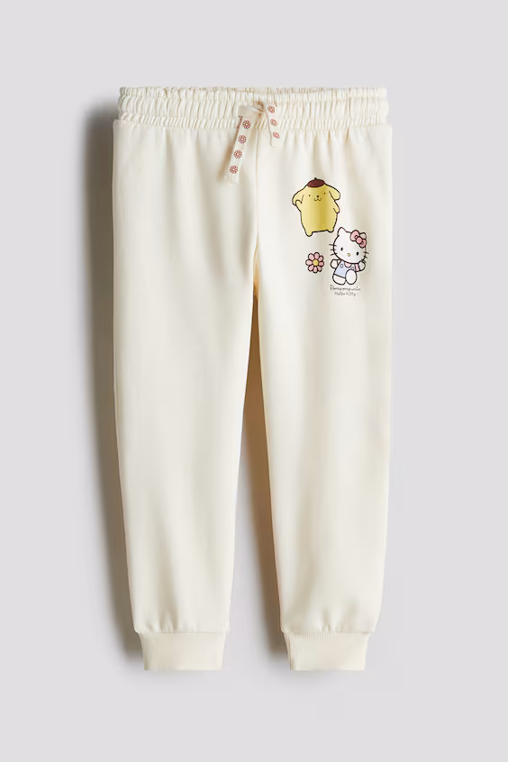 Брюки-джоггеры с принтом и трикотажной отделкой